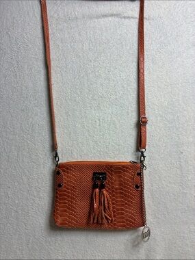 Textured Orange Crossbody Bag with Tassel Accent